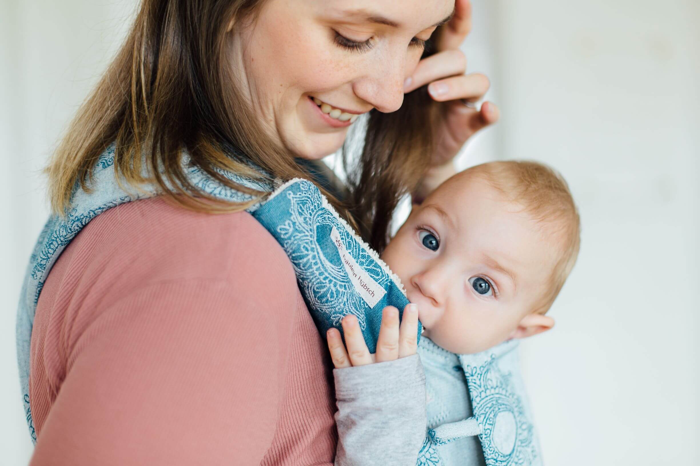 Teething Pads Baby in a Carrier using Teething Pads