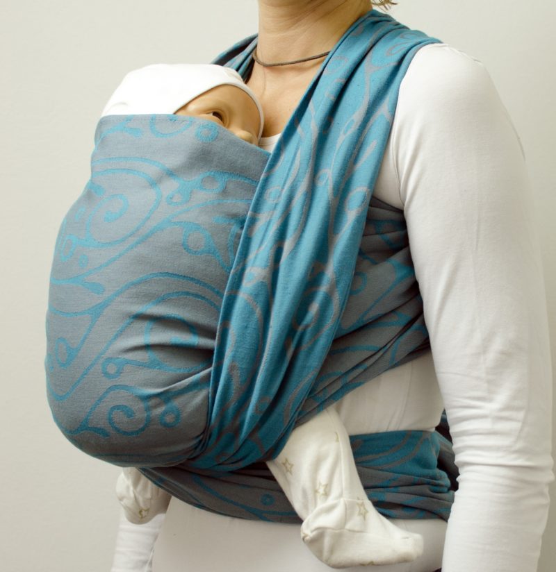 Sling Seaweed Tuerkis carried Tragetuch in Hellgrau und Türkis mit Muster