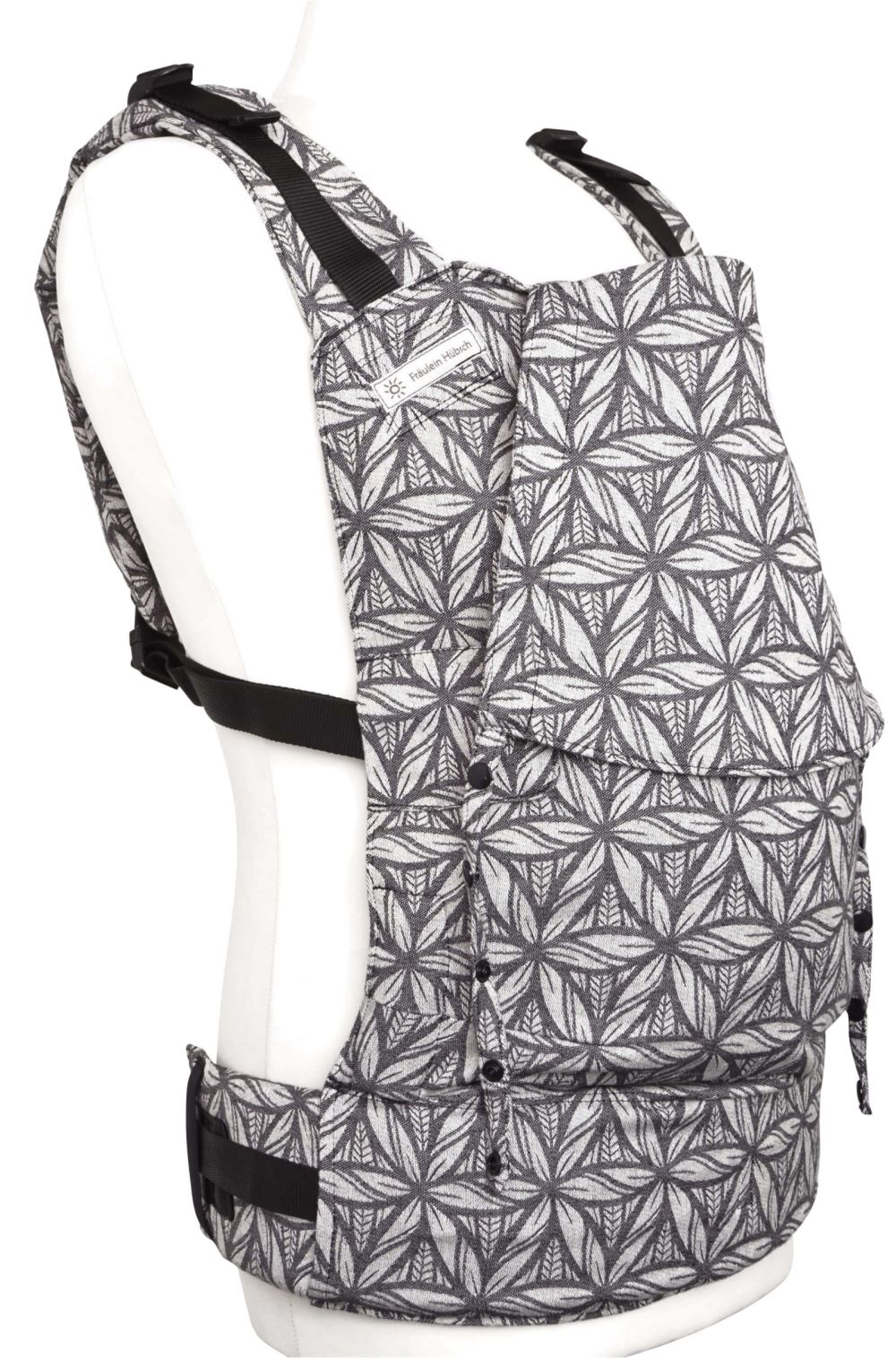Fullbuckle Onesize Lorelei Seitlich Trager im Ruckenteil Fräulein Hübsch Babytrage Fullbuckle in Weiß und Schwarz gemustert in seitlicher Ansicht. Die Schulterträger sind am Rückenteil befestigt.